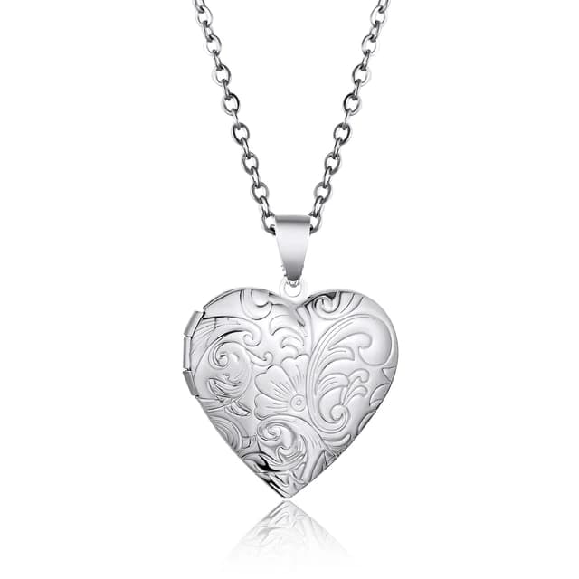 A silver heart locket with a floral lid.