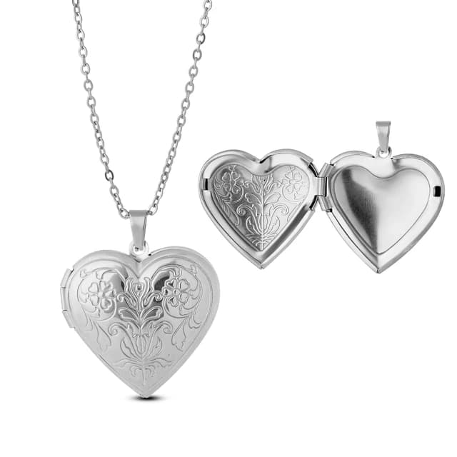 A silver heart locket engraved with a flower.