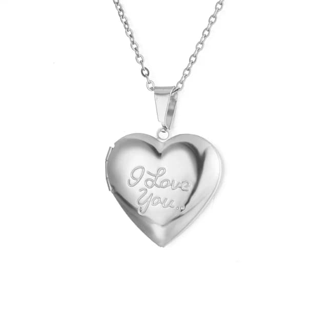 A silver heart locket engraved with the words I love you.
