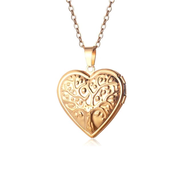 A gold heart locket engraved with a tree.